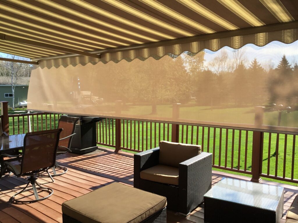 Northeast Ohio porch shaded by a Sunesta awning, with a drop shade blocking the sun from the side.